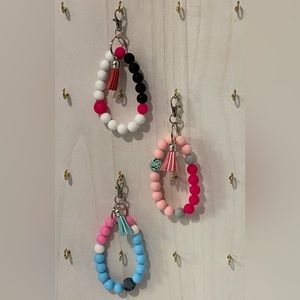 Beaded wristlet keychain with 12mm silicone beads assorted colors.